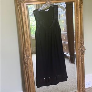 Racer back dress with sheer sequins at hem.